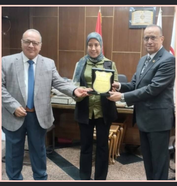 Professor Dr. Alaa Attia, Dean of the Faculty of Medicine and Chairman of the Board of Directors of University Hospitals, and Professor Dr. Mohamed Abdelbaset Khalaf, Vice Dean for Graduate Studies and Research, honored Dr. Noha Othman Abdelhafez, Director of the Scientific Documentation Office at the Faculty of Medicine, for her outstanding role in serving the scientific publishing needs of the Faculty of Medicine and reviewing the linguistic research for the Faculty's journal.