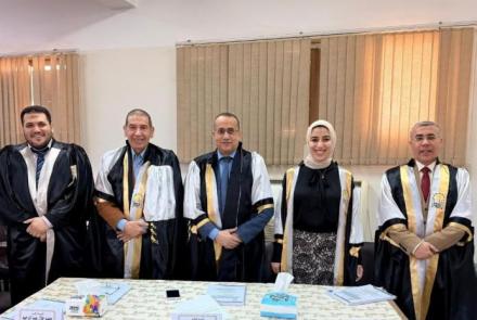 The Dean of the Faculty of Medicine at Assiut University participates in a discussion of a scientific thesis on modern anesthesia techniques for hip fracture surgeries.