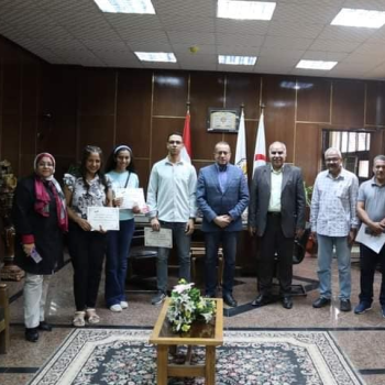 The Dean of the College of Medicine meets with the College of Medicine students who won the art competition