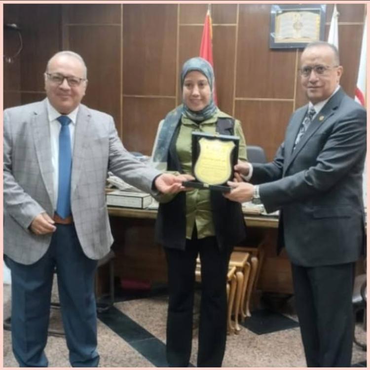 Professor Dr. Alaa Attia, Dean of the Faculty of Medicine and Chairman of the Board of Directors of University Hospitals, and Professor Dr. Mohamed Abdelbaset Khalaf, Vice Dean for Graduate Studies and Research, honored Dr. Noha Othman Abdelhafez, Director of the Scientific Documentation Office at the Faculty of Medicine, for her outstanding role in serving the scientific publishing needs of the Faculty of Medicine and reviewing the linguistic research for the Faculty's journal.